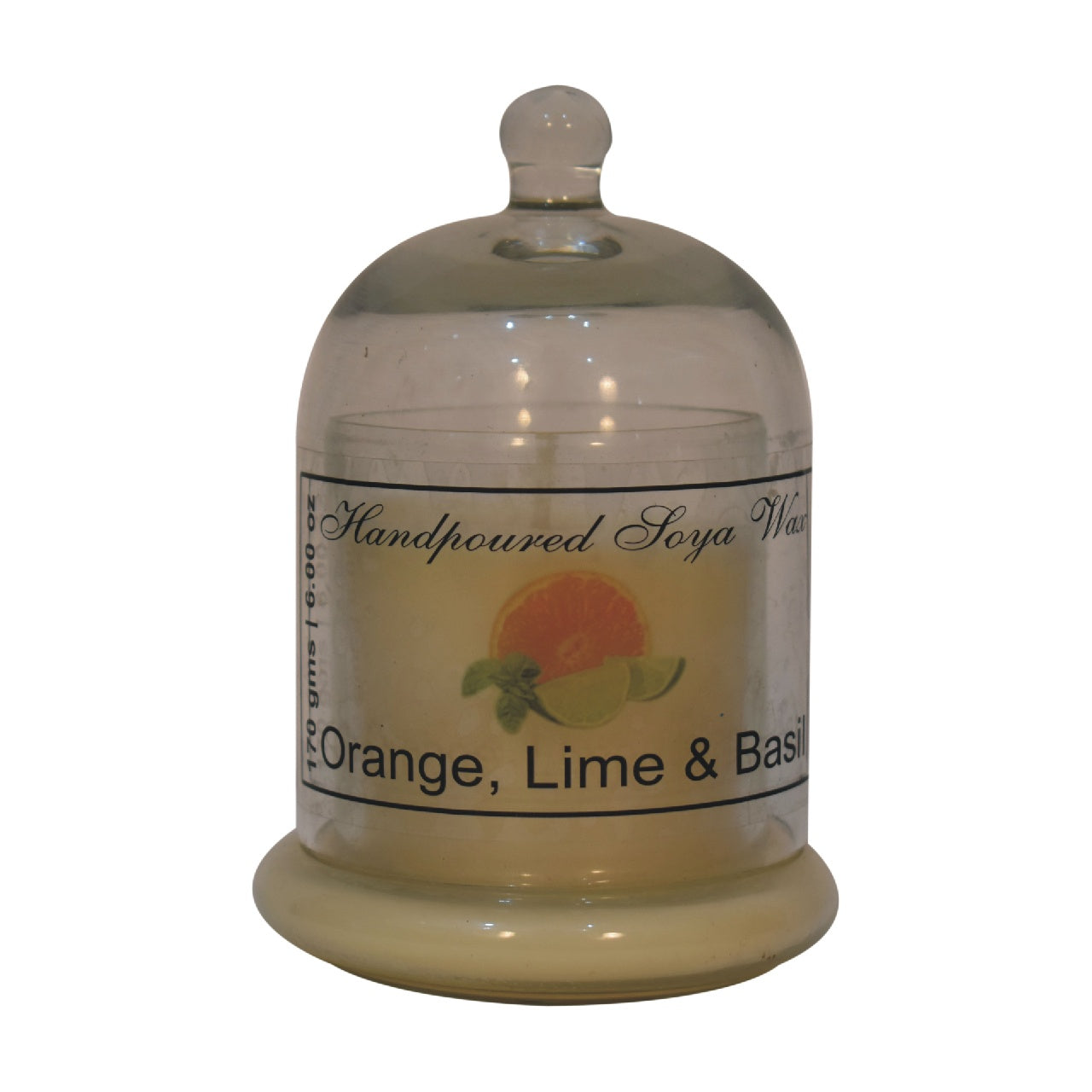 dome-shaped jar with a lime & basil candle inside. set on a white background