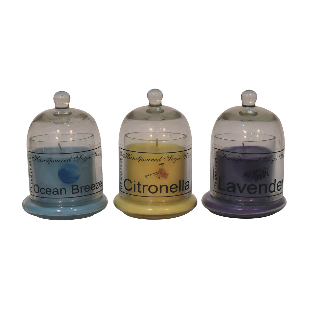 set of 3 dome-shapaed jars with ocean breeze, citronella and lavender candles inside. set on a white background.