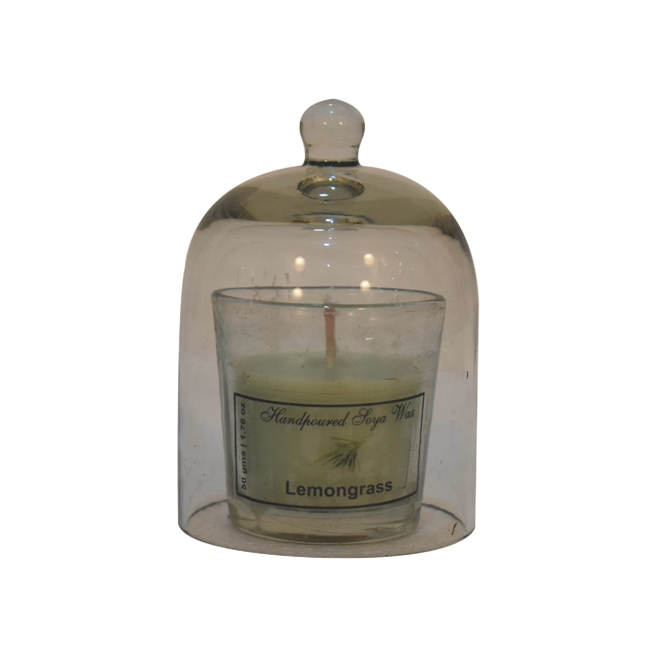 lemongrass candle in a glass dome with white background
