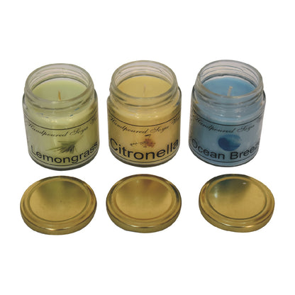 Set of 3 scented candles, includes Lemongrass, Citronella and Summer breeze on a white background 